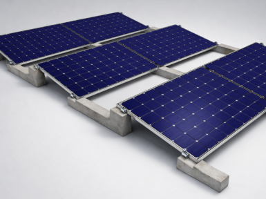 Connected concrete ballast supports forming grid layout for flat roof PV installation