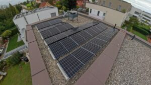 Concrete ballast mount supporting solar module on rooftop