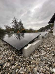 Row of solar panels installed with concrete roof mounting system