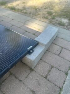 Concrete ballast support for photovoltaic panels on flat roof systems