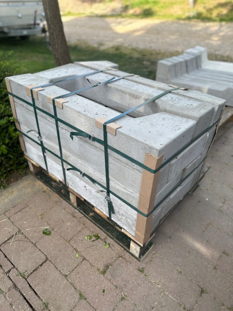 Palletized concrete solar mounting products prepared for transport