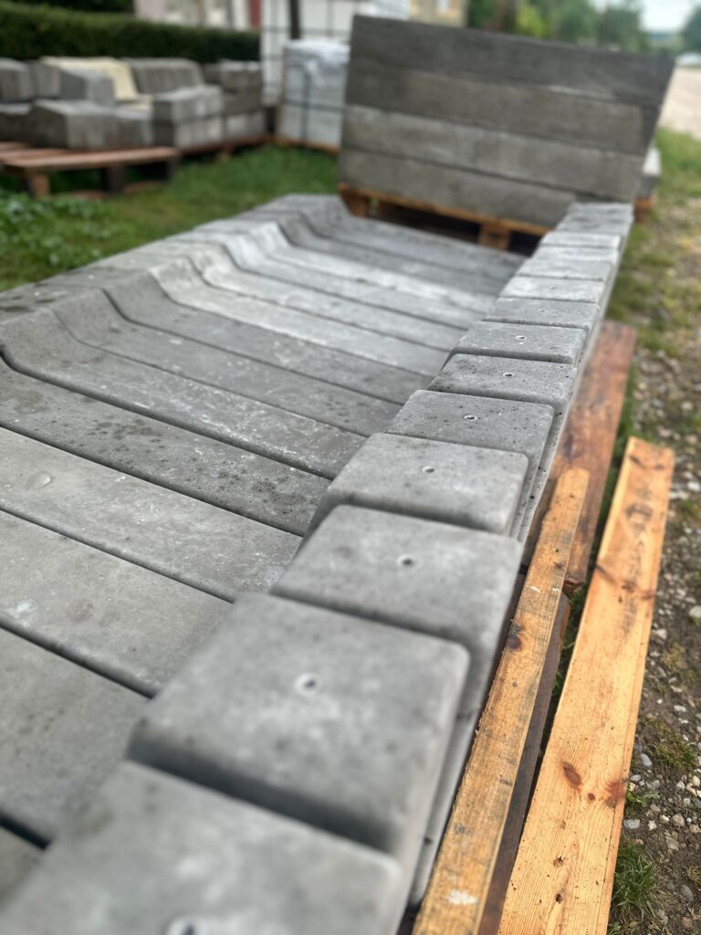 Concrete ballast mounting solution for flat roof solar panels designed for stability and wind resistance.