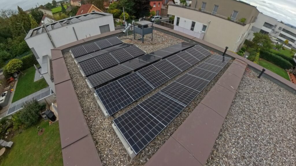 lat roof photovoltaic installation with concrete ballast mounting system
